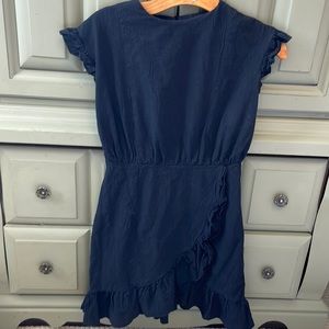 Black sleeveless dress with fringes on sleeve